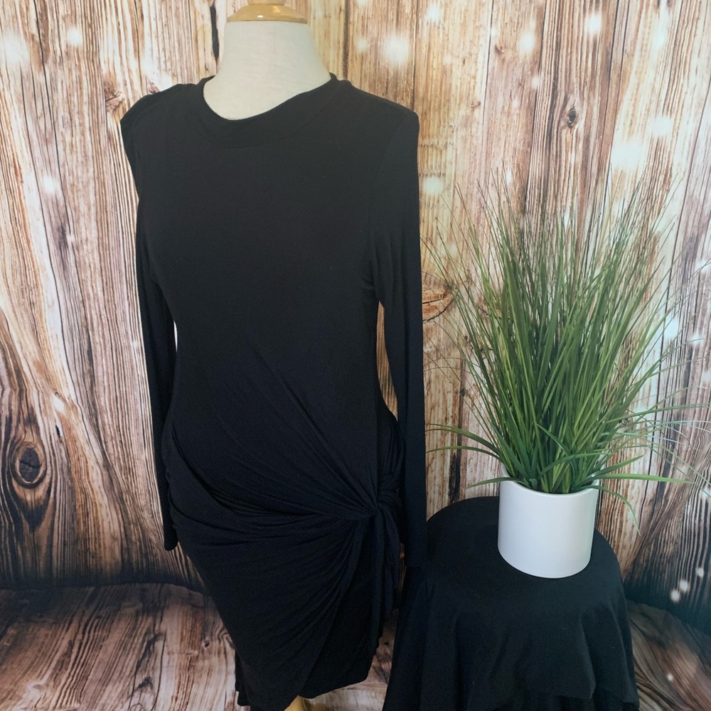 Black, ankle length dress with mock neck.